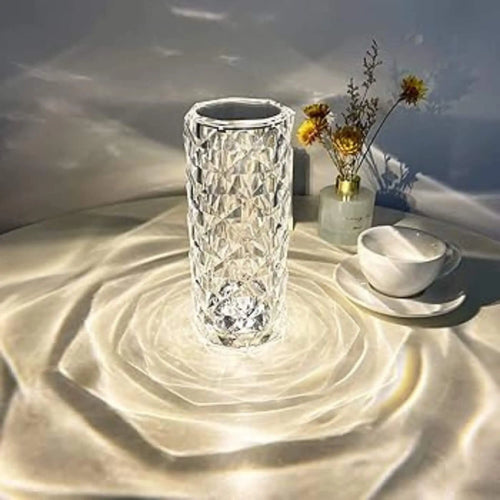 Crystal Light on table with flowers and coffee on plate.